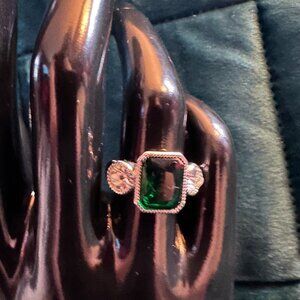 faux emerald emerald cut cz ring with clear cz side stones sz 6.5